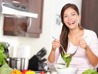 A girl eats-healthy salads